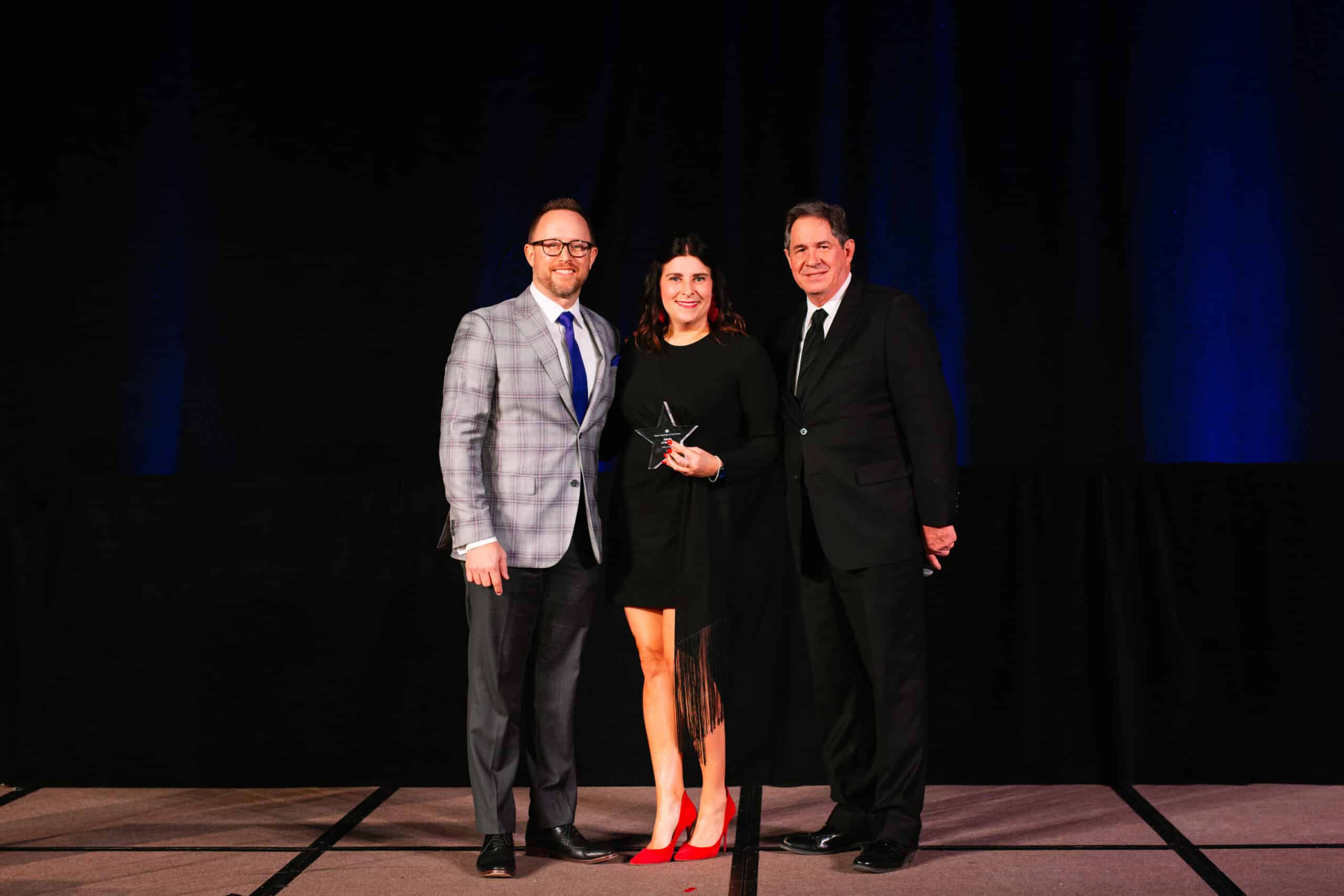 Altair Global Executive Assistant, Amy Fedele, accepting award at Frisco Chamber Awards Gala