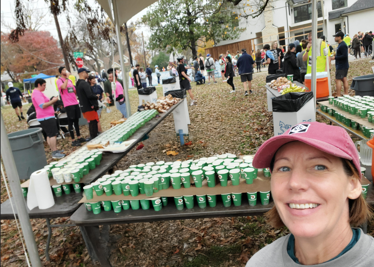 Charlotte volunteering at Dallas Marathon